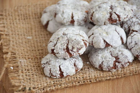 Closeup of chocolate biscuit cookies on wooden tableの写真素材