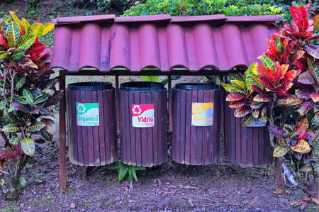 Wooden containers in a row for recycling paper, aluminum, glass and organic wasteの写真素材