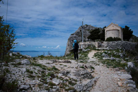 Small medieval stone church on the top of the hillの写真素材