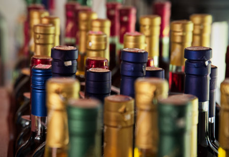 Group of wine bottles standing in a row - selective focusの写真素材