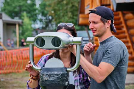 Mature couple using binoculars watching the natureの写真素材