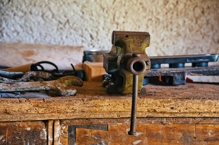 Dirty set of vintage hand tools on wooden table