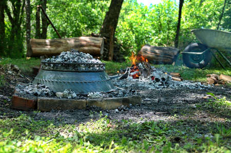 Traditional meat under the oven on open flame in natureの写真素材