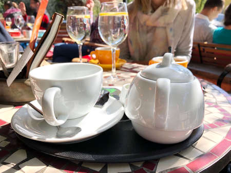 Closeup of tea and water served in the restaurantの写真素材