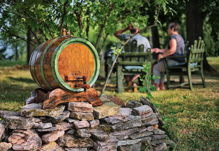 Barrel on stone wall in backyard