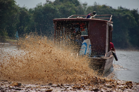 Traveling by boat on Tonle Sap lake along the fishing village Komprongpok