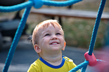 Portrait of sweet little boy on playground