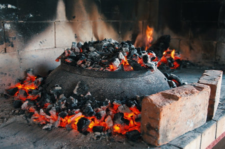Delicious grilled food in pan on open flameの写真素材