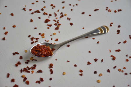 Flat lay of various colorful herbs and spices on white background