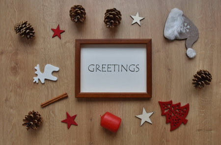 Flat lay of Christmas ornaments on wooden backgroundの写真素材