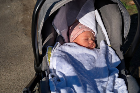Portrait of newborn baby in baby strollerの写真素材