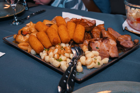 Plate with various food in restaurantの写真素材