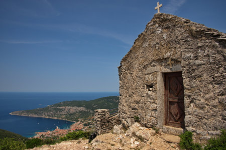 Small medieval stone church on the top of the hill with beautiful view on Adriatic coastの写真素材