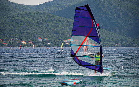Windsurfer surfing on waves in Viganj on Peljesac peninsula, Croatiaの写真素材