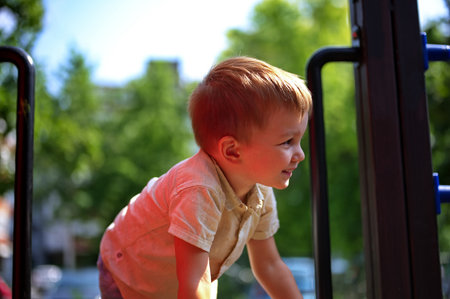 Portrait of sweet little toddler on playgroundの写真素材