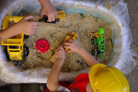 Top shot of toddlers playing in sand