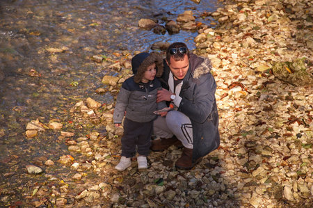 Father with little toddler hiking in the forestの写真素材