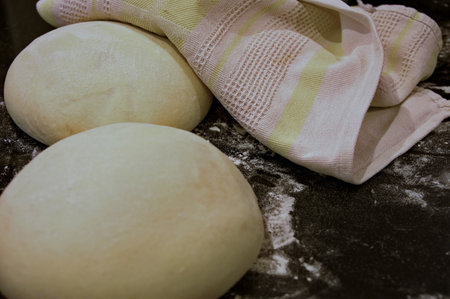 Preparation of homemade bread on kitchen tableの写真素材