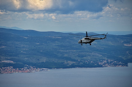 Helicopter flying over Adriatic seaの写真素材