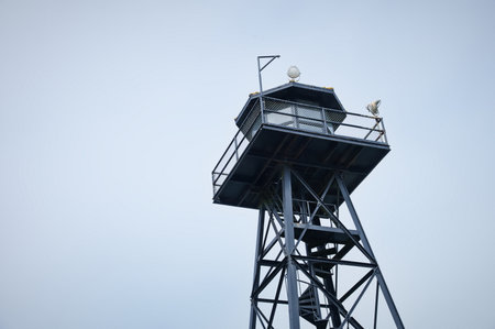 Low angle view of prison guardhouse against skyの写真素材
