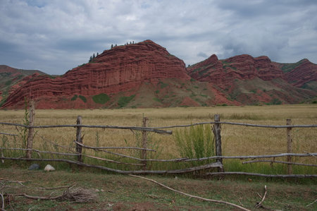 Scenic red rocks mountains in Kyrgyzstanの写真素材