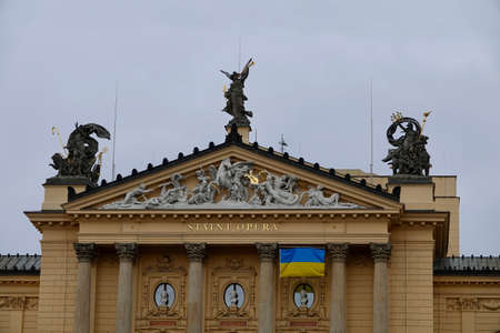 Prague, Czech Republic - March 5 2022: Ukrain flag on opera building in Prague near Wenceslas Square...