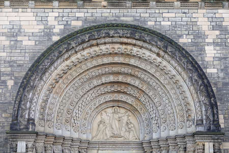 Jesus Christ blesses to Saint Cyril and Methodius. Neo-romanesque portal of old Saint Cyril and Methodius Church in Karlin, Prague, Czech Republic. High quality photoの写真素材