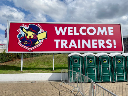 London, United Kingdom - September 11 2022: A billboard with an inscription Welcome trainers and a picture of Pikachu in front of exhibition and international convention centre ExCeL London.のeditorial素材