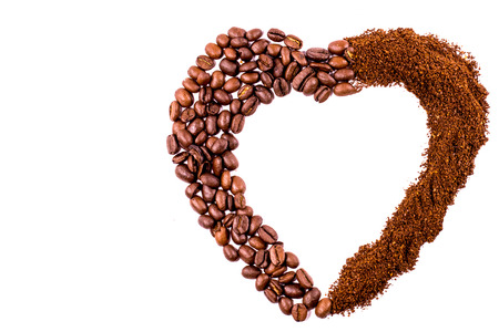 Heart of coffee beans and ground coffee isolated on white background  with clipping path.の写真素材