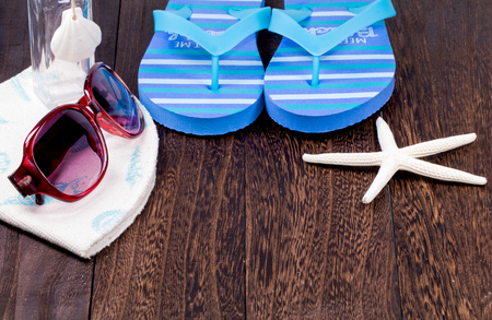 Summer beach vacation,straw hat,sunglasses ,Sea objects  on wooden background with copy space.の写真素材