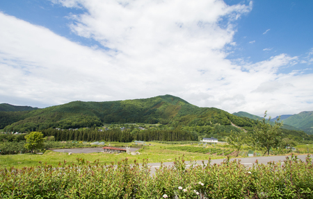 Beautiful landscape of Takayama mura at sunny summer or spring day and blue sky in Kamitakai District in northeast Nagano Prefecture Japan.の写真素材