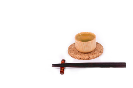 Hot green tea and  Chopsticks on white background  with clipping path.の写真素材