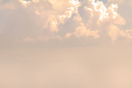 Sky background with white clouds and  sun rays.の写真素材