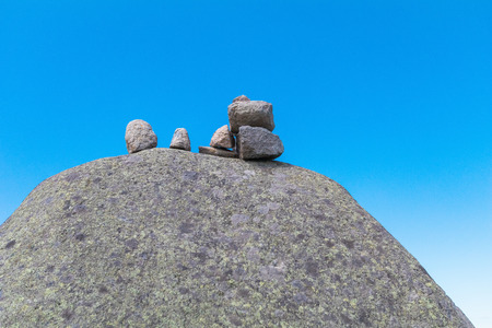 Zen stones on rock for  meditation  on the blue sky background  at Utsukushigahara is  one of the most important and popular natural place in Nagano , Japan.の写真素材