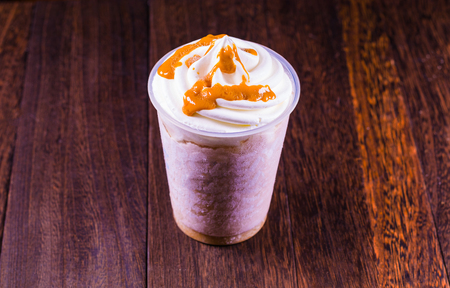 Chocolate ice cream in a cup on a grey wooden table wall background  with copy space and clipping path.の写真素材
