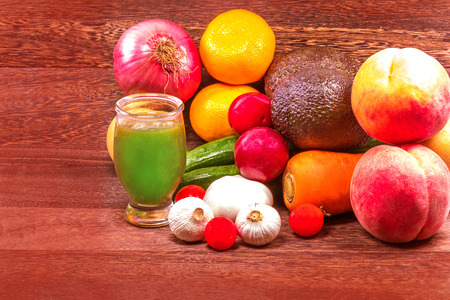 Fresh organic fruits in wicker basket on a grey wooden table wall background with copy space .の写真素材