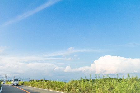 Beautiful landscape view and  a country road  in spring day with  blue sky  background of  Yamanashi Prefecture, Japan .の写真素材