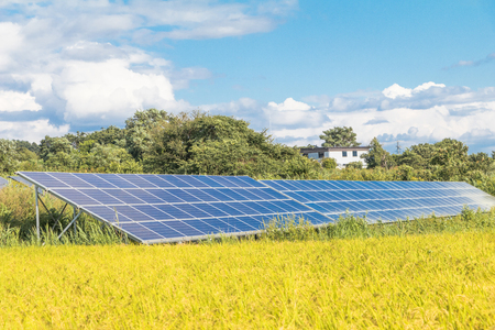 Solar power panels ,Photovoltaic modules for innovation green energy for life  with blue sky background .の写真素材
