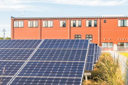 Solar power panels ,Photovoltaic modules for innovation green energy for life   with blue sky background .の写真素材