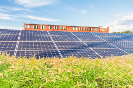 Solar power panels ,Photovoltaic modules for innovation green energy for life   with blue sky background .の写真素材
