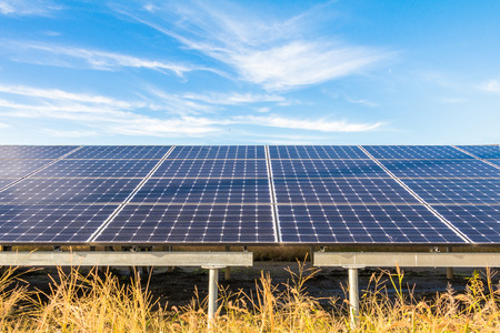 Solar power panels ,Photovoltaic modules for innovation green energy for life   with blue sky background .の写真素材