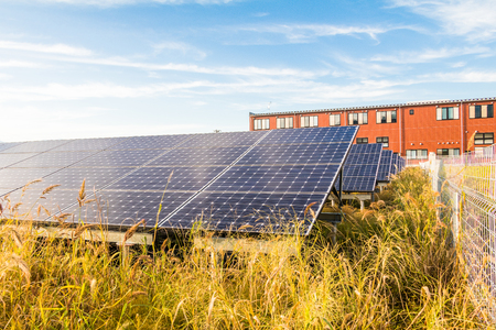 Solar power panels ,Photovoltaic modules for innovation green energy for life with blue sky backgroundの写真素材