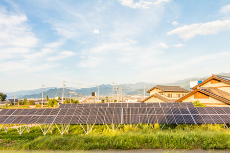 Solar power panels ,Photovoltaic modules for innovation green energy for life   with blue sky background .の写真素材