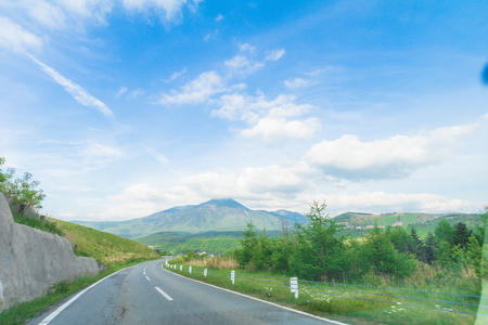 Beautiful  landscape view of  a country road with  blue sky  background in Utsukushigahara park is  one of the most important and popular natural place in Nagano Prefecture , Japan.の写真素材