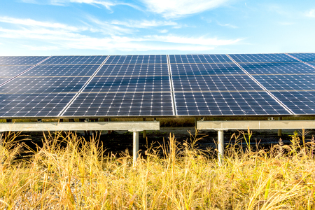 Solar power panels ,Photovoltaic modules for innovation green energy for life with blue sky backgroundの写真素材