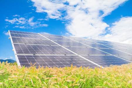 Solar power panels ,Photovoltaic modules for innovation green energy for life with blue sky backgroundの写真素材
