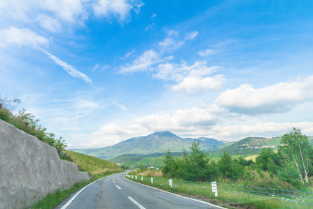 Beautiful  landscape view of  a country road with  blue sky  background in Utsukushigahara park is  one of the most important and popular natural place in Nagano Prefecture , Japan.の写真素材