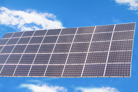 Solar  power panels for innovation green energy for life with mountains and blue sky background.の写真素材