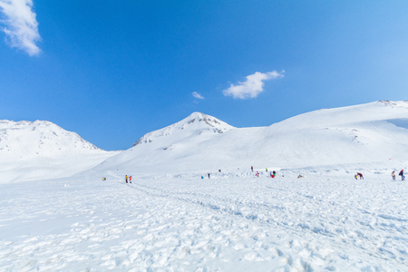 The snow mountains of Tateyama Kurobe alpine  with blue sky  background is  one of the most important and popular natural place in Toyama Prefecture, Japan.の写真素材