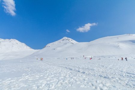 The snow mountains of Tateyama Kurobe alpine  with blue sky  background is  one of the most important and popular natural place in Toyama Prefecture, Japan.の写真素材